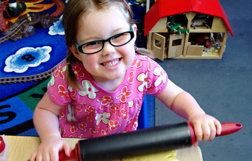 Preschool student enjoying a classroom activity