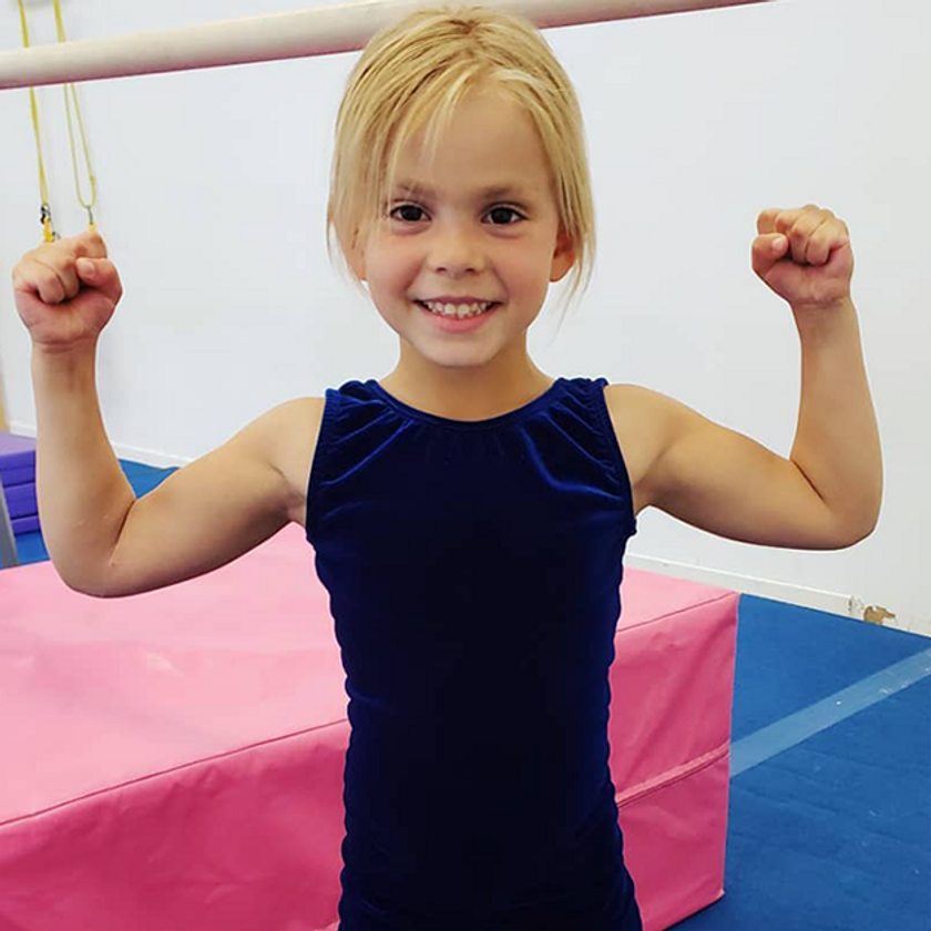 Smiling young gymnast