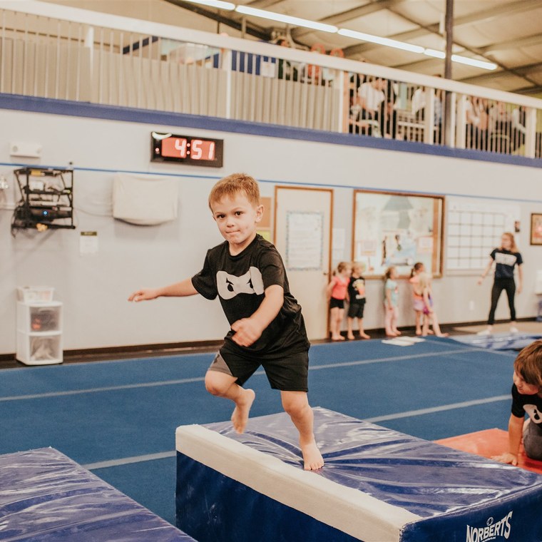 Preschoolers balancing on the beam