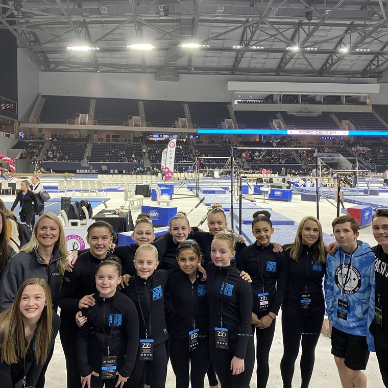 The team on the competition floor at a championship meet